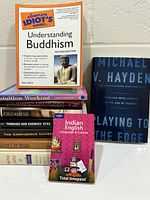 Group view of stacked and standing books showing most titles