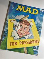 Front cover showing Alfred E. Neuman breaking through campaign sign