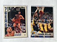 Front view of both cards in sleeves