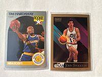 Front views of both trading cards in sleeves