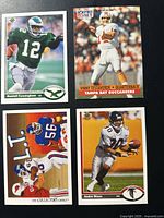 All four NFL trading cards laid out