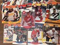 Spread of numerous Pro Set hockey cards including Yzerman, Nieuwendyk, Messier, Chelios, Bourque, Turgeon
