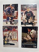 Front views of Graves and Moog cards showing player images and logos