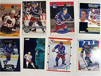 Eight Brian Leetch hockey cards arranged in two rows showing fronts
