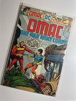 Front cover of OMAC #8 comic in sleeve
