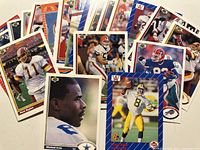 Spread of Upper Deck NFL cards showing various players