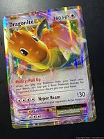Front view of Dragonite-EX card showing artwork, holographic finish and stats