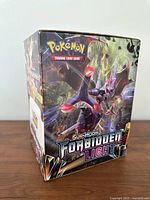 Front angle showing artwork and set name on empty box