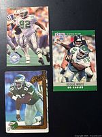Fronts of three Reggie White Eagles trading cards