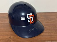 Front view of helmet showing SD logo and autograph