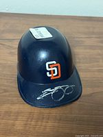 Front view showing SD logo and autograph on brim