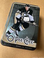 Lid of metal tin showing Sidney Crosby and O-Pee-Chee 2009-10 branding