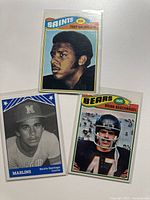 Fronts of three sleeved trading cards: Tony Galbreath, Brian Baschnagel, Bennie Santiago