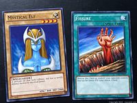 Front view of both Yu-Gi-Oh cards Mystical Elf and Fissure