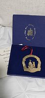 Ornament inside presentation box with informational card visible