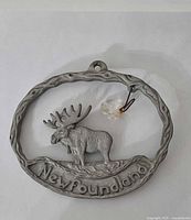 Front view of pewter Newfoundland moose ornament with crystal accent