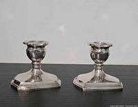 Front view of both silverplate candlesticks