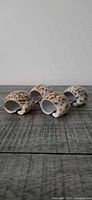 Four porcelain napkin rings angled side view