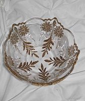 Top view showing scalloped rim and gold floral/leaf motifs inside bowl