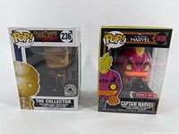 Front view of both boxed Funko Pop figures (#236 The Collector gold and #908 Captain Marvel neon)