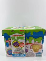Front view of sealed Nickelodeon Slime Super Slime Unboxing kit showing branding and contents list