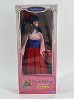 Front view of boxed Sakura Wars CharaDoll Selection #01 showing doll, outfit and sword