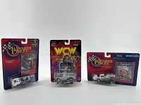 Group shot of all three sealed diecast items on cards