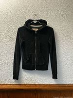Front view of Hollister velvet zip hoodie jacket
