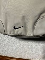 Front lower corner with black Nike swoosh logo