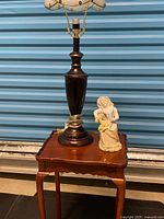 Overall shot showing lamp, figurine and side table together