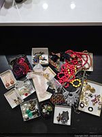 Overview of entire jewelry lot on table