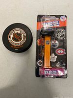 Front of puck and packaged PEZ dispenser