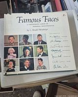 Front cover showing title, author, nine sample portraits on dust jacket