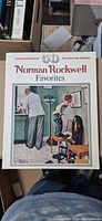 Front cover showing title ‘Norman Rockwell Favorites’ and sample image