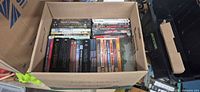 Open box showing entire assortment of DVDs and Blu-ray sets
