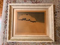 Full view of framed artwork on patterned surface