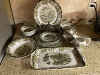 All 22 pieces grouped on countertop showing pattern and variation of sizes