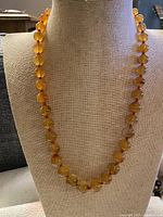 Necklace displayed on bust showing bead color and spacing