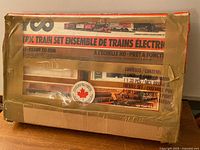 Front of large Tyco electric train set box with tape and bilingual title
