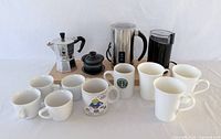 Group shot of all coffee and tea equipment and mugs