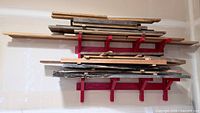 Overall view of stacked lumber on red cleat rack