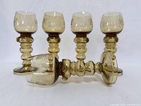 Five amber Austrian Roemer goblets, one lying to show stem detail