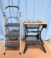 Both the Gorilla three-step stool and Black & Decker Workmate 225 workbench standing side by side, folded open