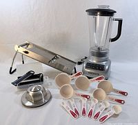 Group shot showing blender, mandoline slicer, measuring cups and spoons