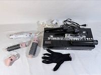 Entire lot showing Revlon hot-air brush system, NuMe 3P Curler set with three barrels, heat glove