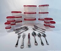 Containers stacked with matching lids and flatware laid out
