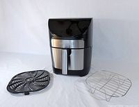 Front view of air fryer with crisper tray and wire rack