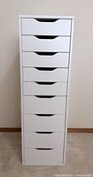 front view of white IKEA nine-drawer cabinet