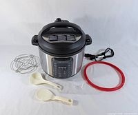 Cooker with all accessories laid out