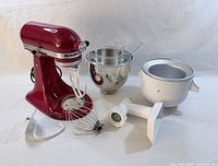 Overall lot showing mixer, bowl, shield, three beaters, food grinder, ice-cream bowl